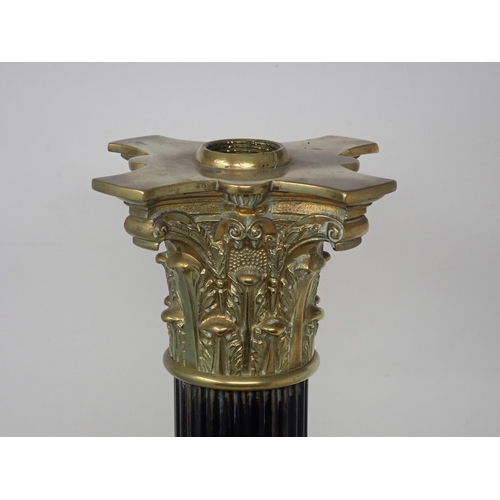 487 - An Empire style Table Lamp with brass capital, ebonised reeded column and square base, 17in H