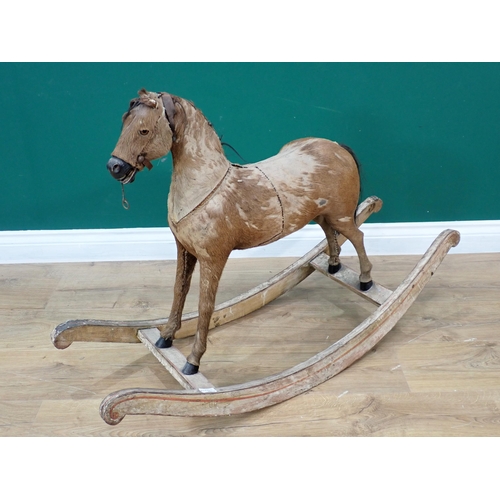 497 - An antique fur covered Rocking Horse on white painted rockers 3ft 2in L x 2ft 2in H