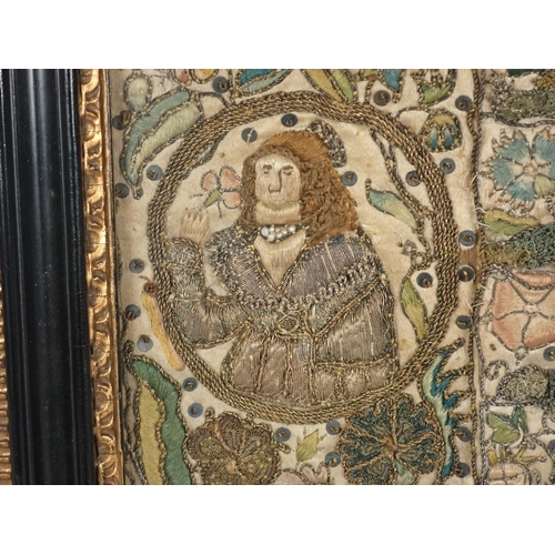 501 - A 17th Century Stumpwork Panel depicting two portraits of figures with floral motifs in gold and col... 