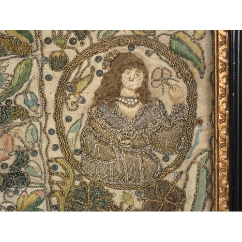 501 - A 17th Century Stumpwork Panel depicting two portraits of figures with floral motifs in gold and col... 