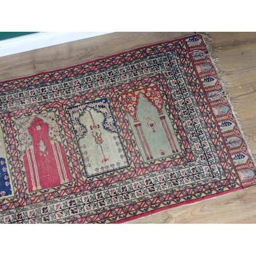 505 - A Persian Prayer Rug, multi-bordered and with seven mihrabs of differing designs, 7ft 9in L x 2ft 11... 