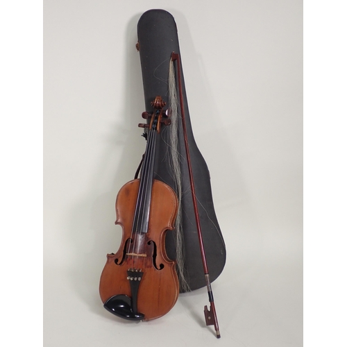 507 - A 7/8ths Violin labelled Antonio Stradivarious, Farrebar with two piece back with bow in case