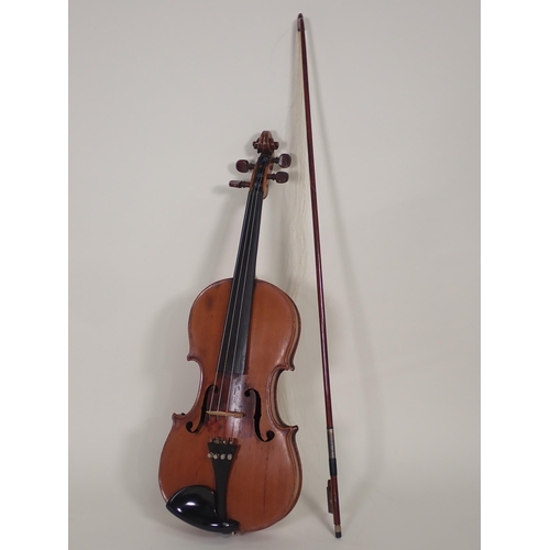 507 - A 7/8ths Violin labelled Antonio Stradivarious, Farrebar with two piece back with bow in case