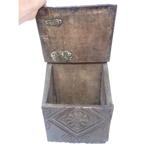 538 - An early 18th Century oak Candle Box with rosette carved sloping lid and front 1ft 4in H x 9in W