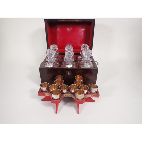 546 - A Georgian brass bound walnut Decanter Box containing six square cut glass Decanters and stoppers wi... 