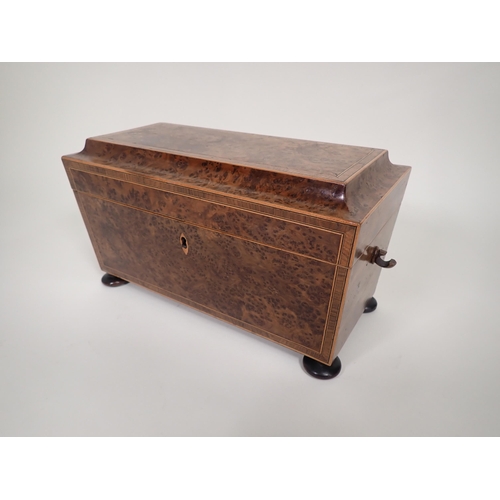 551 - An early 19th Century burr yew Tea Caddy of sarcophagus shape with cross-banding and stringing, two ... 