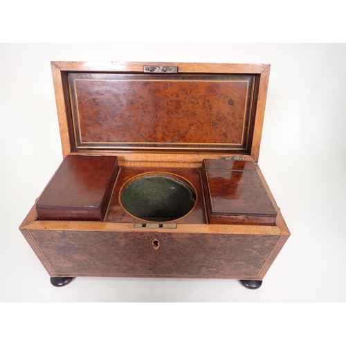 551 - An early 19th Century burr yew Tea Caddy of sarcophagus shape with cross-banding and stringing, two ... 