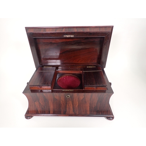 552 - A 19th Century rosewood Tea Caddy of sarcophagus shape, with interior lidded boxes, ring handles on ... 