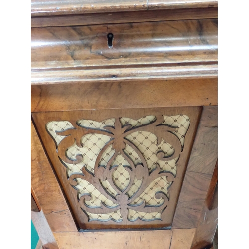 561 - A Victorian walnut Sewing Table with moulded hinged top enclosing compartments, some with fret carve... 