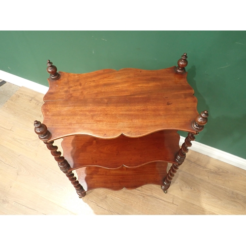 570 - A 19th Century mahogany serpentine three tier Etergere with spiral turned supports and casters, 2ft ... 