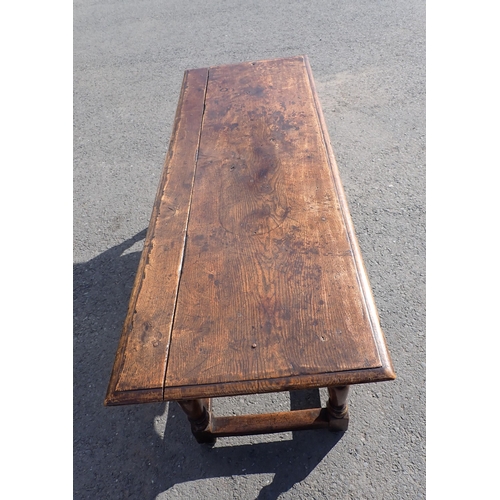 572 - An antique oak Refectory Table in the 17th Century style with moulded top above a shaped and channel... 