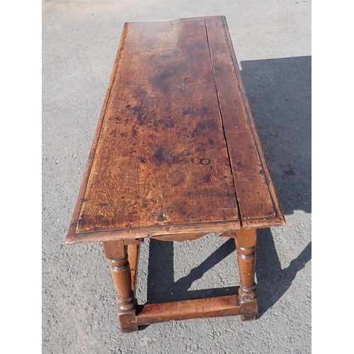 572 - An antique oak Refectory Table in the 17th Century style with moulded top above a shaped and channel... 