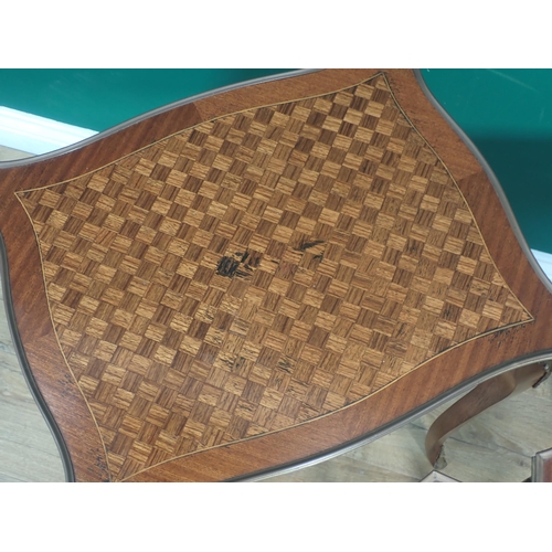 573 - A nest of three French Tables with shaped rectangular tops having parquetry inlay and edged in brass... 