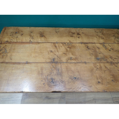 575 - A burr oak Refectory Table in 16th Century style with three plank cleated top raised on two cross-fo... 