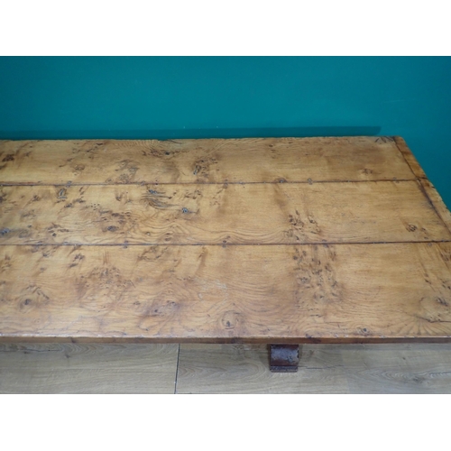 575 - A burr oak Refectory Table in 16th Century style with three plank cleated top raised on two cross-fo... 