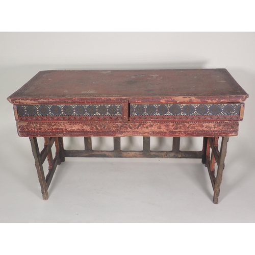 576 - A Chinese Scribe's Table with red lacquered and painted detail having two frieze drawers with slidin... 