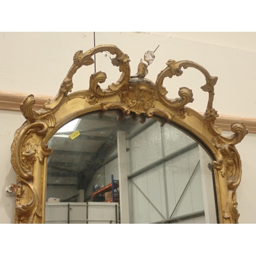 577 - A pair of 18th Century gilt Pier Mirrors with console base, having pierced and scrolled surmounts, b... 