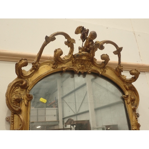 577 - A pair of 18th Century gilt Pier Mirrors with console base, having pierced and scrolled surmounts, b... 