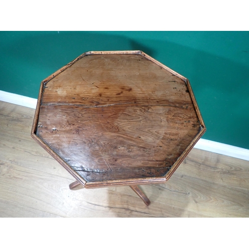 578 - An antique Candle Stand with octagonal yew top with gallery on vase turned oak column and elm tripod... 