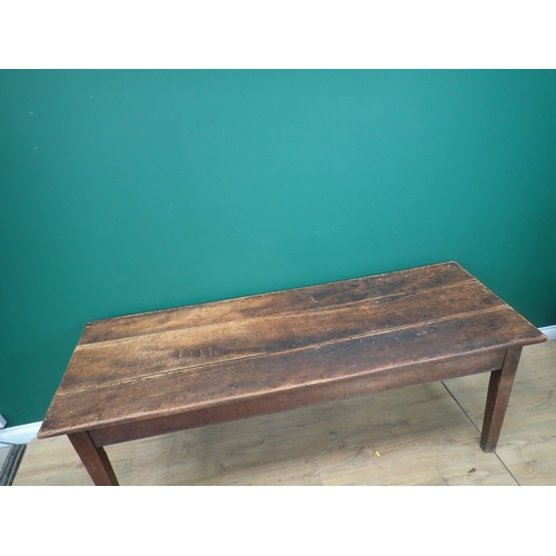 580 - An 18th Century elm Refectory Table with three-plank top, with moulded frieze and raised on squared ... 