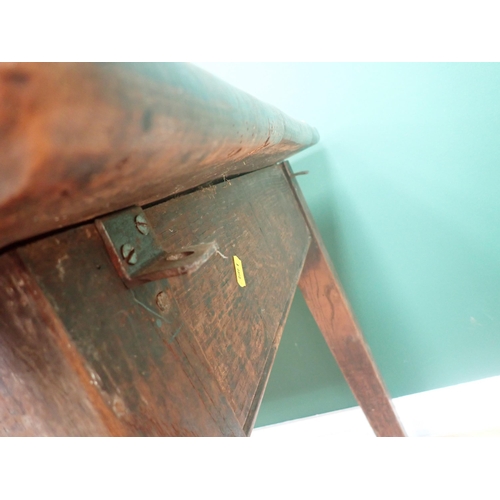 580 - An 18th Century elm Refectory Table with three-plank top, with moulded frieze and raised on squared ... 