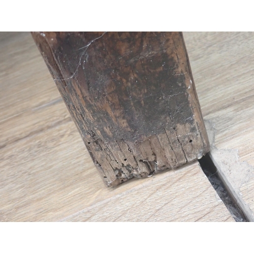 580 - An 18th Century elm Refectory Table with three-plank top, with moulded frieze and raised on squared ... 