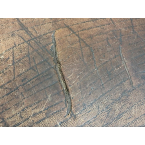 580 - An 18th Century elm Refectory Table with three-plank top, with moulded frieze and raised on squared ... 