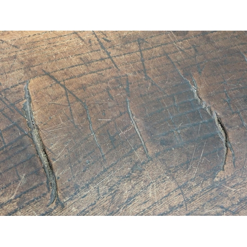 580 - An 18th Century elm Refectory Table with three-plank top, with moulded frieze and raised on squared ... 