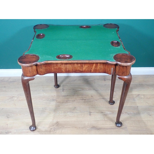 584 - A Georgian mahogany Card Table with shaped fold-over top enclosing baize lining and counter wells, r... 