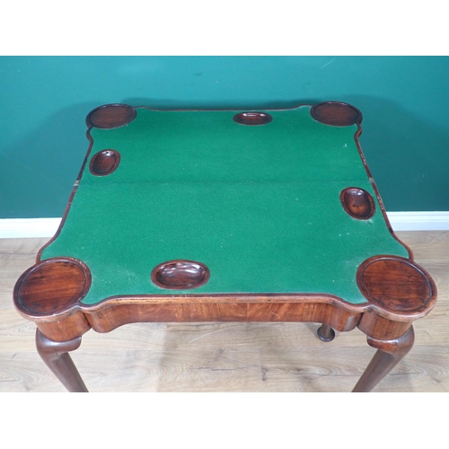 584 - A Georgian mahogany Card Table with shaped fold-over top enclosing baize lining and counter wells, r... 