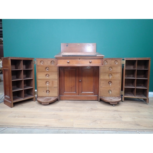 592 - An unusual Clerk's Desk in walnut by James Shoolbred & Co with central sloping hinged desk flanked b... 