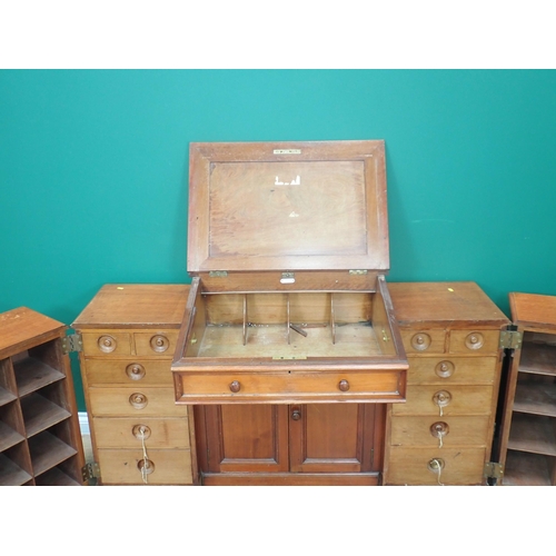 592 - An unusual Clerk's Desk in walnut by James Shoolbred & Co with central sloping hinged desk flanked b... 