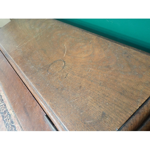 592 - An unusual Clerk's Desk in walnut by James Shoolbred & Co with central sloping hinged desk flanked b... 