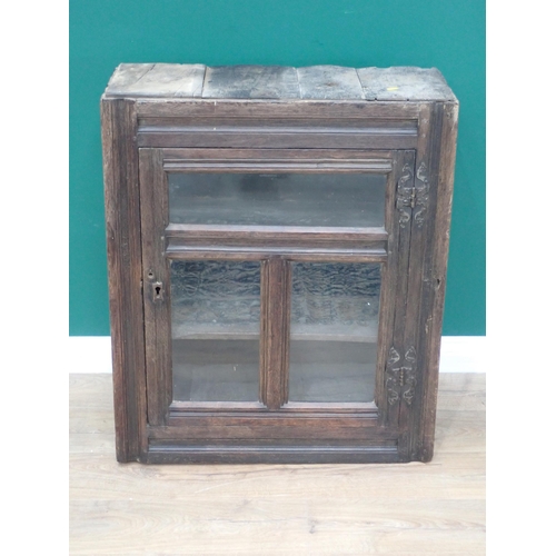 594 - A 17th Century and later oak and glazed Wall Cupboard with channel moulded frame 2ft 11in H x 2ft 5i... 