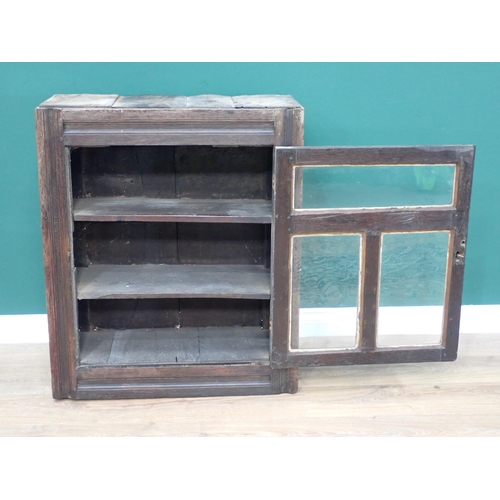 594 - A 17th Century and later oak and glazed Wall Cupboard with channel moulded frame 2ft 11in H x 2ft 5i... 