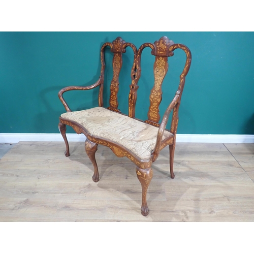 597 - An 18th Century walnut and marquetry inlaid Salon Sofa with double shaped vase splat back surmounted... 