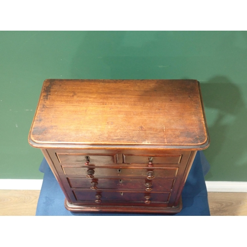 602 - A 19th Century miniature Chest of Drawers with moulded top above two short and three long graduated ... 