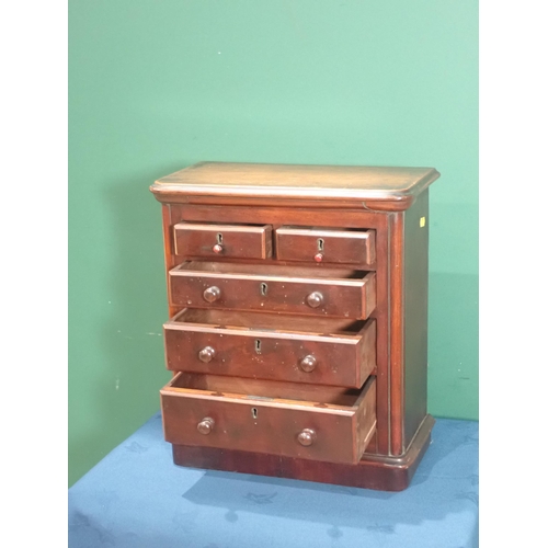 602 - A 19th Century miniature Chest of Drawers with moulded top above two short and three long graduated ... 