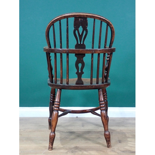 608 - A 19th Century ash and elm Windsor Elbow Chair with pierced splat back mounted upon turned supports ... 