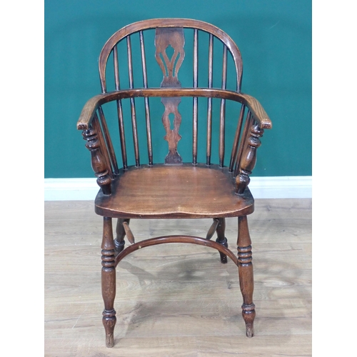 609 - A 19th Century ash Windsor Elbow Chair mounted upon turned supports united by crinoline stretcher 2f... 