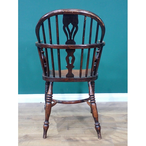 609 - A 19th Century ash Windsor Elbow Chair mounted upon turned supports united by crinoline stretcher 2f... 