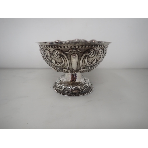 61 - An 18th Century Dutch silver oval Brandy Bowl with lobed and scroll embossing, flat pierced handles ... 