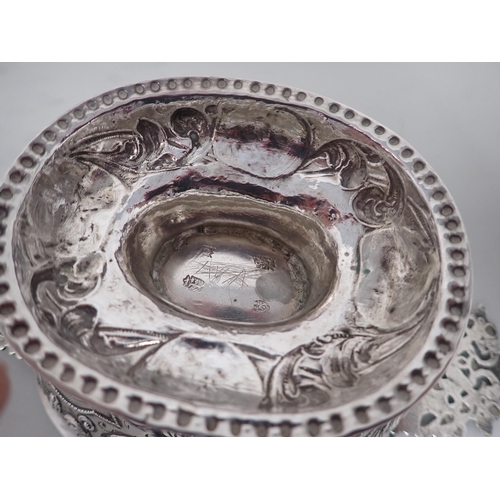 61 - An 18th Century Dutch silver oval Brandy Bowl with lobed and scroll embossing, flat pierced handles ... 