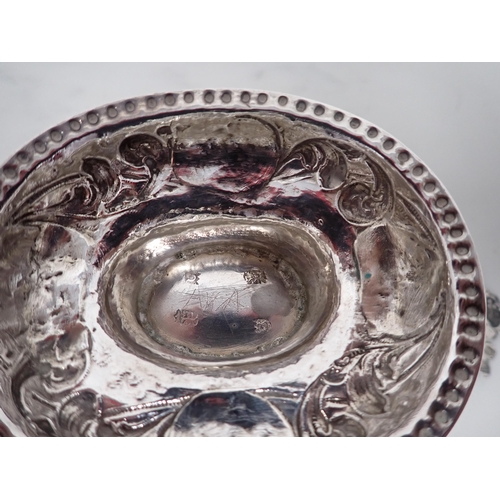 61 - An 18th Century Dutch silver oval Brandy Bowl with lobed and scroll embossing, flat pierced handles ... 