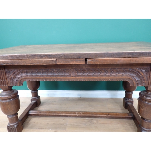 623 - An antique oak draw-leaf Table utilising 17th Century and later timber with leafage carved frieze an... 