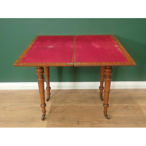 629 - A Constantine & Co oak Card Table with folding and revolving top, raised on turned tapering supports... 