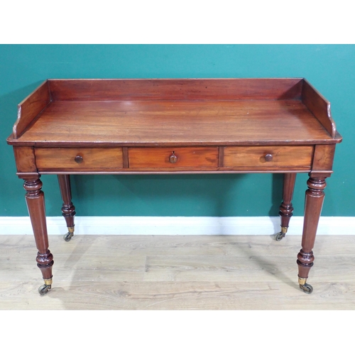 630 - A 19th Century mahogany Gillows Washstand with raised back fitted three drawers on turned tapering s... 