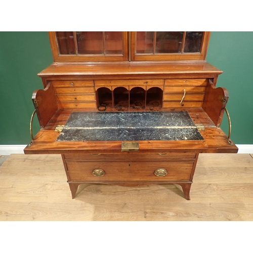 635 - An early 19th Century mahogany Secretaire Bookcase, the fitted drawer with oval inlaid decoration, o... 