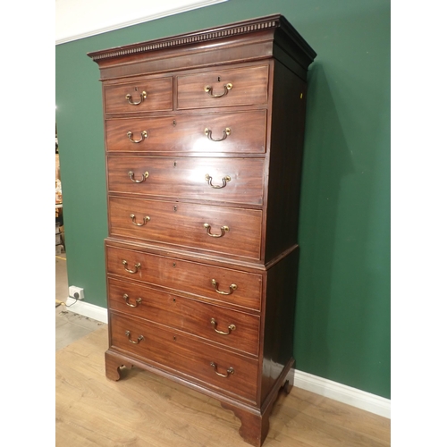 636 - A 19th Century mahogany Chest on Chest with carved dentil cornice above two short and six long drawe... 