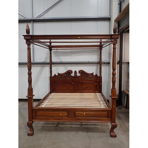 642 - A reproduction four poster Bed with scrolled carved and panelled headboard, spiral turned and carved... 